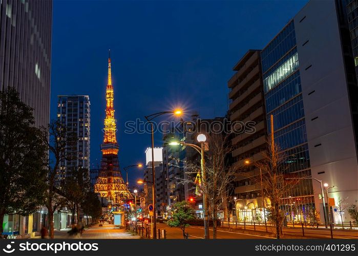 Tokyo Tower at dusk with Tokyo skyline city scape in monato ward. Tokyo Tower is famous landmark height 332.9 metres, the second-tallest tower in Japan.