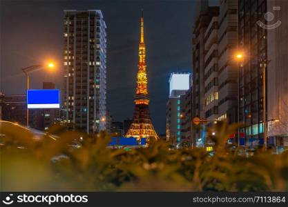Tokyo Tower at dusk with Tokyo skyline city scape in monato ward. Tokyo Tower is famous landmark height 332.9 metres, the second-tallest tower in Japan.