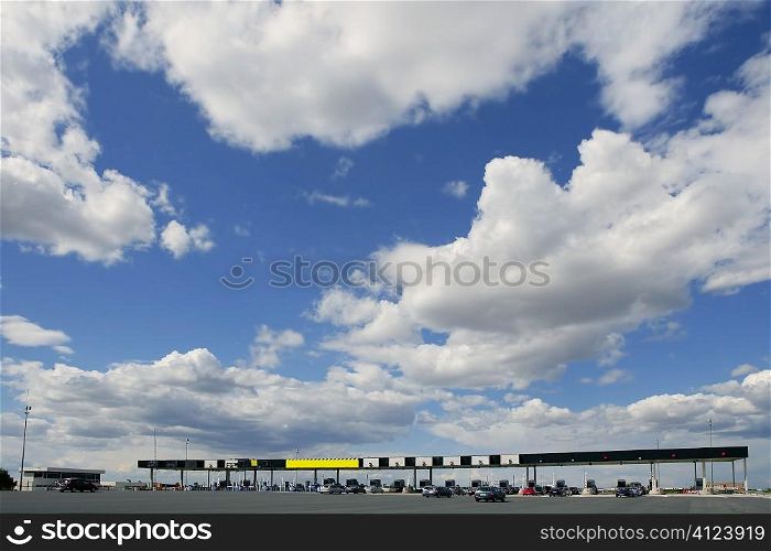Toll motorway road in Europe in a sunny blue day with clouds