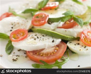 Tomato Avocado and Mozzarella Salad with Olive Oil and Black Pepper