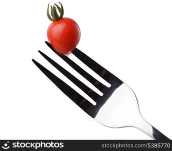 Tomato cherry on a fork close up isolated on white. Diet and regular healthy concept