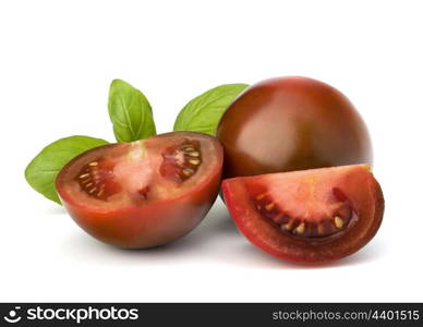 Tomato kumato and basil leaf isolated on white background