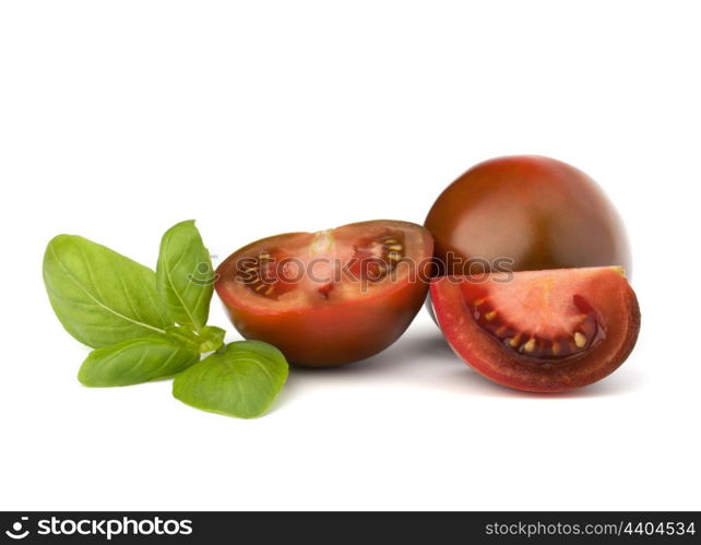 Tomato kumato and basil leaf isolated on white background