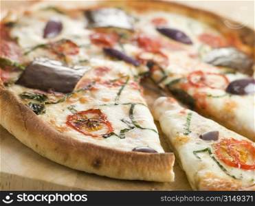 Tomato Mozzarella Aubergine and Basil Pizza