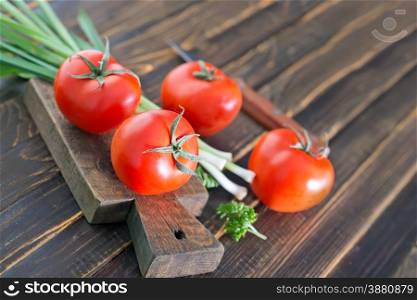 tomato on board and on a table