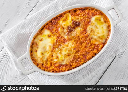 Tomato risotto with mozzarella in baking dish