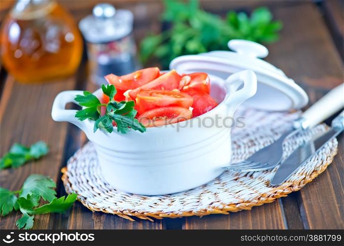 tomato salad in bowl on the wooden table