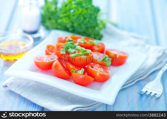 tomato salad on plate and on a table