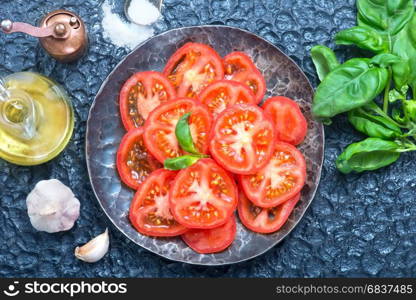 tomato salad on plate and on a table