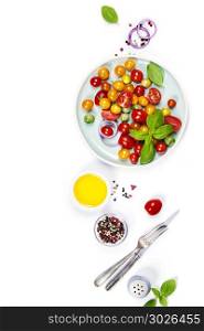 Tomato salad with fresh tomatoes, basil and olive oil on white background with copyspace. Tomato salad with fresh tomatoes, basil and olive oil. Tomato salad with fresh tomatoes, basil and olive oil