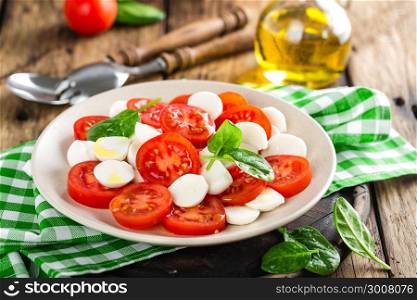 Tomato salad with mozzarella cheese and olive oil