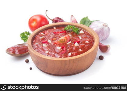 tomato sauce in gravy boat on white background