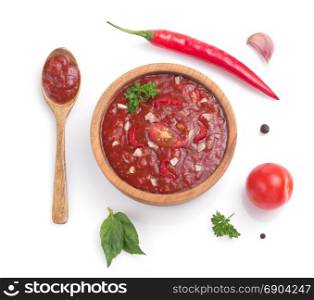 tomato sauce in gravy boat on white background