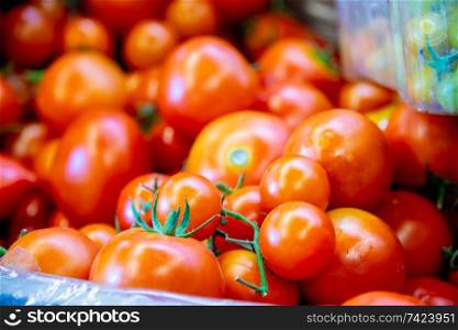 Tomatoes at the market display stall