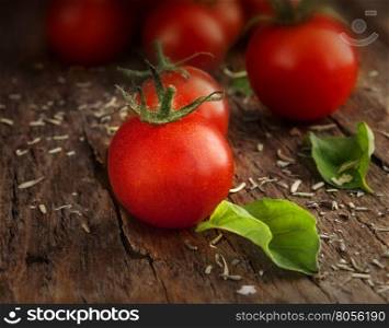 Tomatoes cherry on a wooden surface with natural light