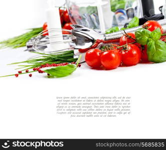 Tomatoes, chives and blender for cooking