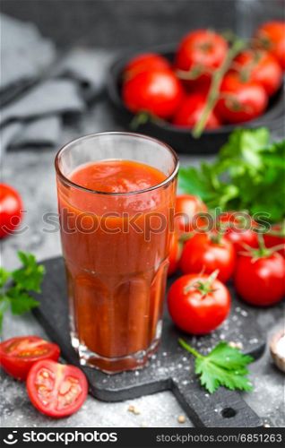 tomatoes; food; red; fresh; background; vegetable; ripe; organic; healthy; cherry; vegetarian; ingredient; green; natural; juice; juicy; raw; closeup; nutrition; tasty; cut; drinking; table; cuisine; delicious; kitchen; cherry tomatoes; cherry tomato; tomato juice; tomato juice glass; glass; slice; vitamin; freshness; fresh tomato; diet; tomatos; small; gourmet; tomato; drink; beverage; healthy; liquid; smoothie; detox; cocktail; bloody mary; bloody mary cocktail;. Tomato juice and fresh tomatoes