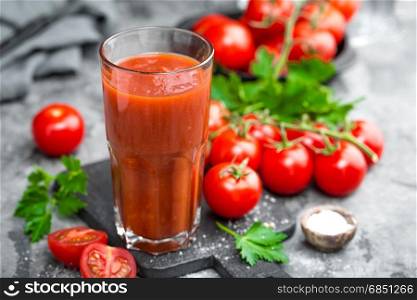 tomatoes; food; red; fresh; background; vegetable; ripe; organic; healthy; cherry; vegetarian; ingredient; green; natural; juice; juicy; raw; closeup; nutrition; tasty; cut; drinking; table; cuisine; delicious; kitchen; cherry tomatoes; cherry tomato; tomato juice; tomato juice glass; glass; slice; vitamin; freshness; fresh tomato; diet; tomatos; small; gourmet; tomato; drink; beverage; healthy; liquid; smoothie; detox; cocktail; bloody mary; bloody mary cocktail;. Tomato juice and fresh tomatoes