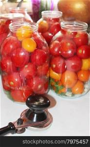 tomatoes in the jars prepared for preservation. red tomatoes ready to pour boiling water conservation