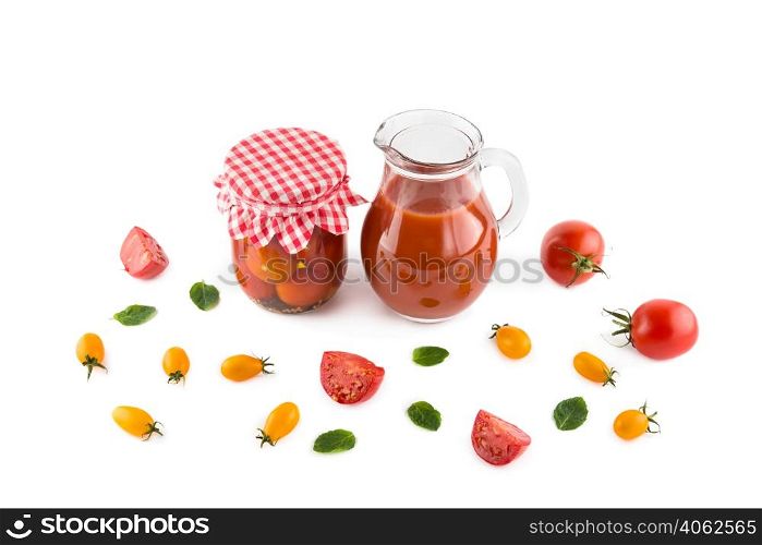Tomatoes, juice and canned vegetables isolated on white background.