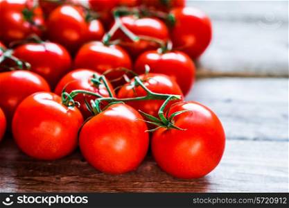 Tomatoes on wooden background