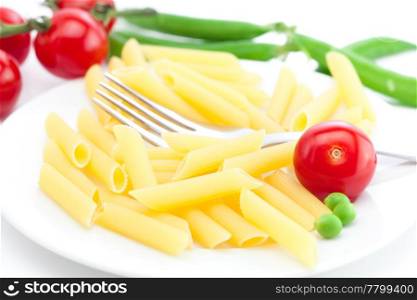 tomatoes, peas, pasta and fork on a plate isolated on white