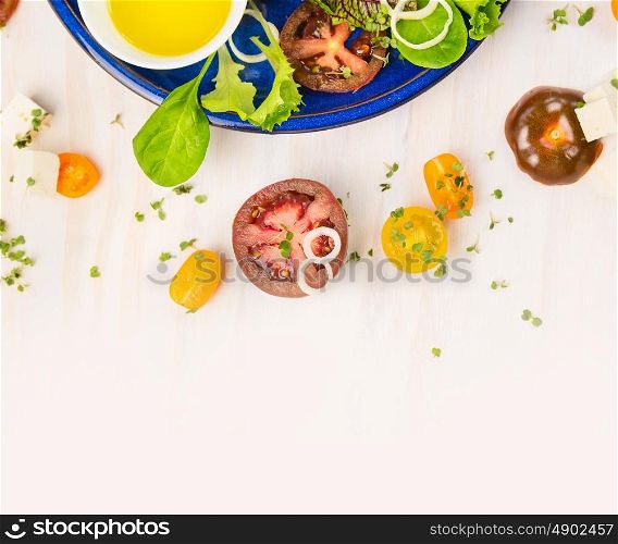 Tomatoes salad making with oil and cress on white wooden background, top view