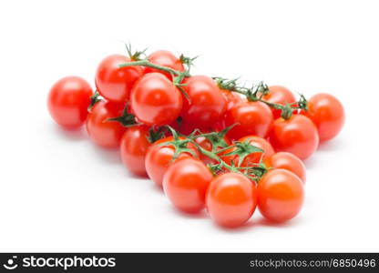 tomatoes with green leaves isolated on white background