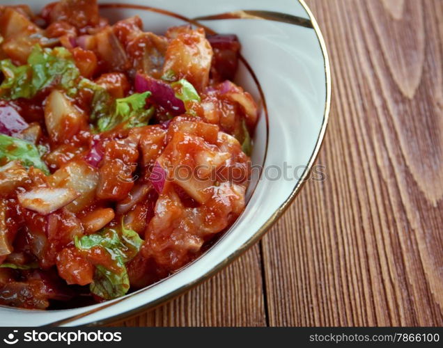 Tomatsild - Norwegian dish of pickled herring, onion and tomato paste