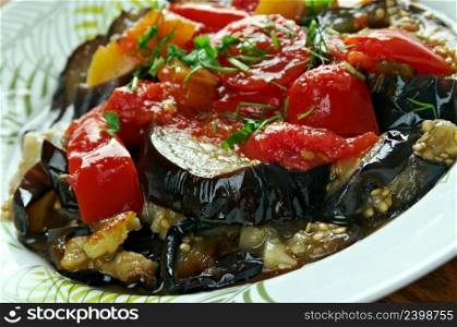 Tombet -  traditional vegetable dish from Majorca. sliced  aubergines and red bell peppers  fried in olive oil.