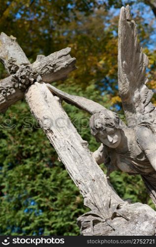 Tombstone an angel with a cross. Since its creation in 1787 Lychakiv Cemetery Lvov, Ukraine.