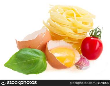 Tonarelli and tagliatelle raw pasta. Tagliatelle raw pasta with egg and tomato isolated on white background