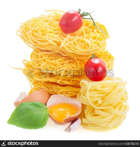 Tonarelli and tagliatelle raw pasta. Tonarelli and tagliatelle raw pasta with egg and tomato isolated on white background