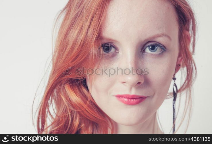 Toned image of the Beautiful sexy woman with red hair (ginger haired or carrot top)