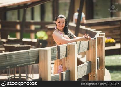 Toned portrait of beautiful smiling woman posing next to canal at old european city