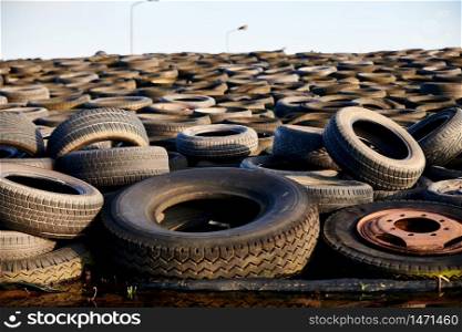 tons of old used tyres in a mix