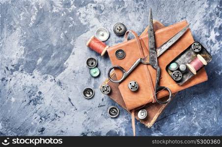 Tool for tailor. Fashionable buttons for clothes, scissors and sewing threads.Copy space