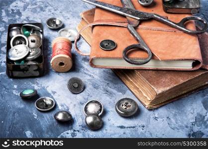 Tool for tailor. Stylish buttons for clothes, scissors and sewing threads