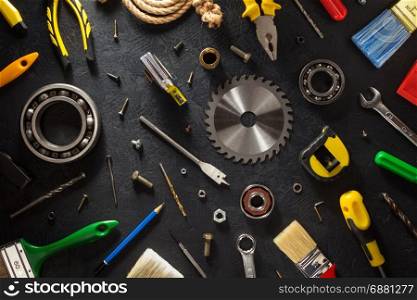tools and instruments on black background