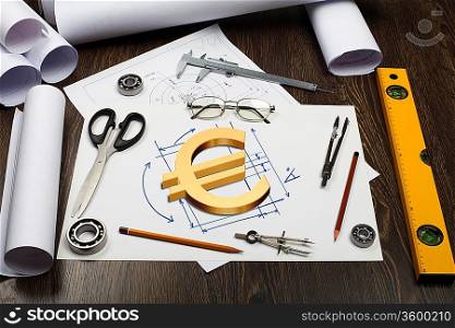 Tools and papers on the table with financial symbols