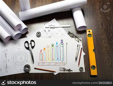 Tools and papers on the table with industrial symbols