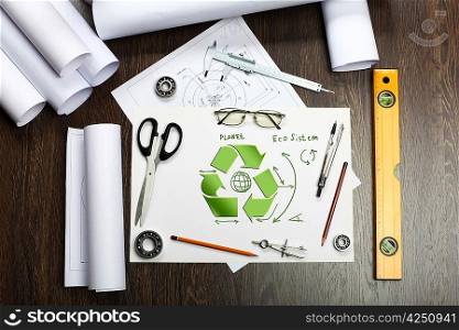 Tools and papers on the table with industrial symbols