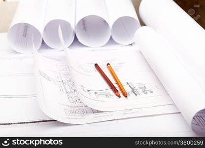 Tools and papers with sketches on the table