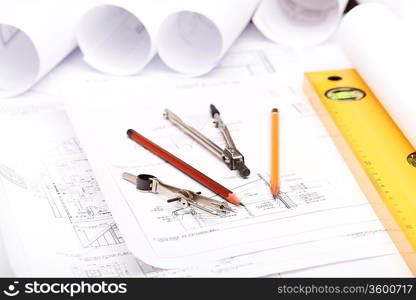 Tools and papers with sketches on the table