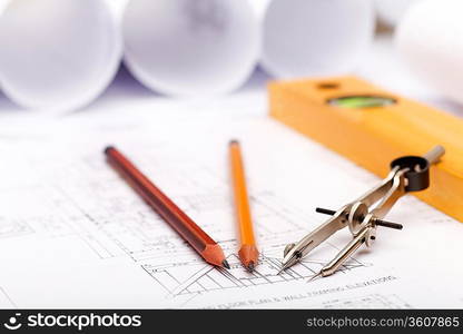 Tools and papers with sketches on the table