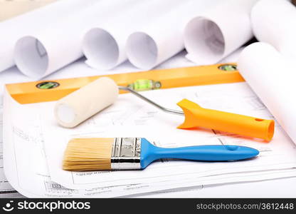 Tools and papers with sketches on the table