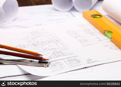 Tools and papers with sketches on the table