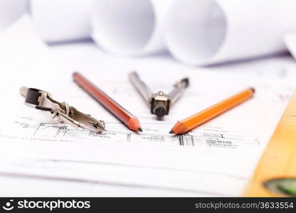 Tools and papers with sketches on the table