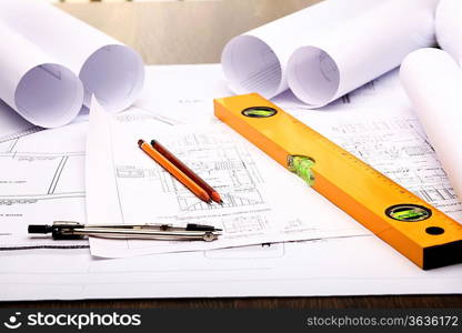 Tools and papers with sketches on the table