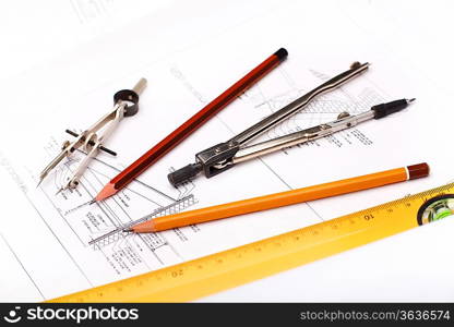 Tools and papers with sketches on the table